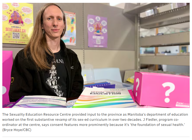 A screenshot from the article, containing a photo of J Fiedler sitting in the library at the SERC Winnipeg office. There is a caption that says: The Sexuality Education Resource Centre provided input to the province as Manitoba's department of education worked on the first substantive revamp of its sex-ed curriculum in over two decades. J Fiedler, program coordinator at the centre, says consent features more prominently because it's 'the foundation of sexual health.' (Bryce Hoye/CBC)